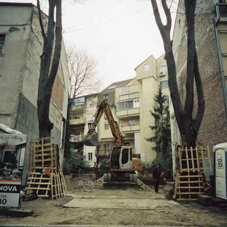 A construction site in a residential area with construction equipment
