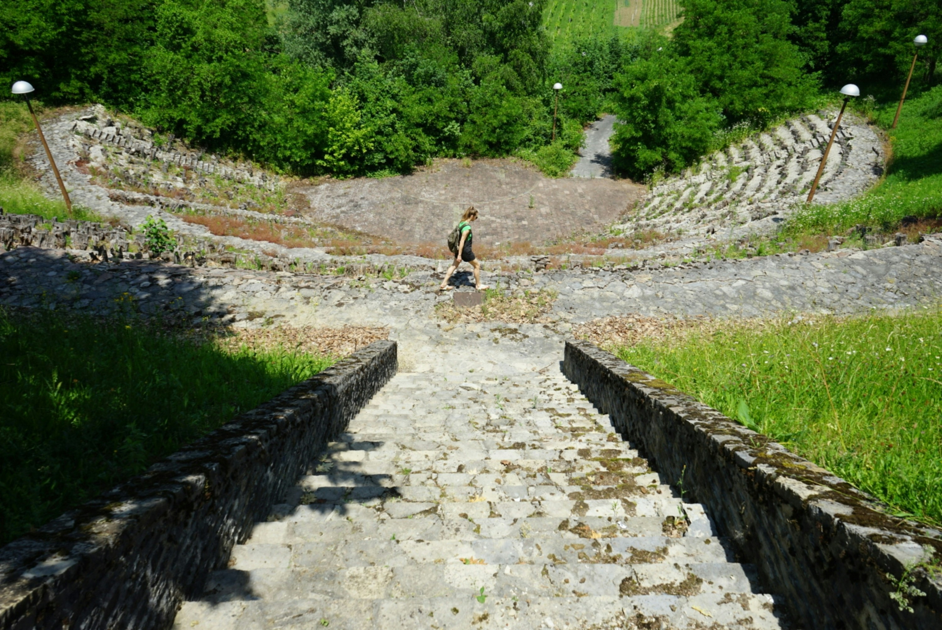 A man standing on top of a stone walkway