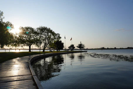 The sun is setting over a body of water