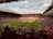 A stadium filled with lots of people watching a soccer game