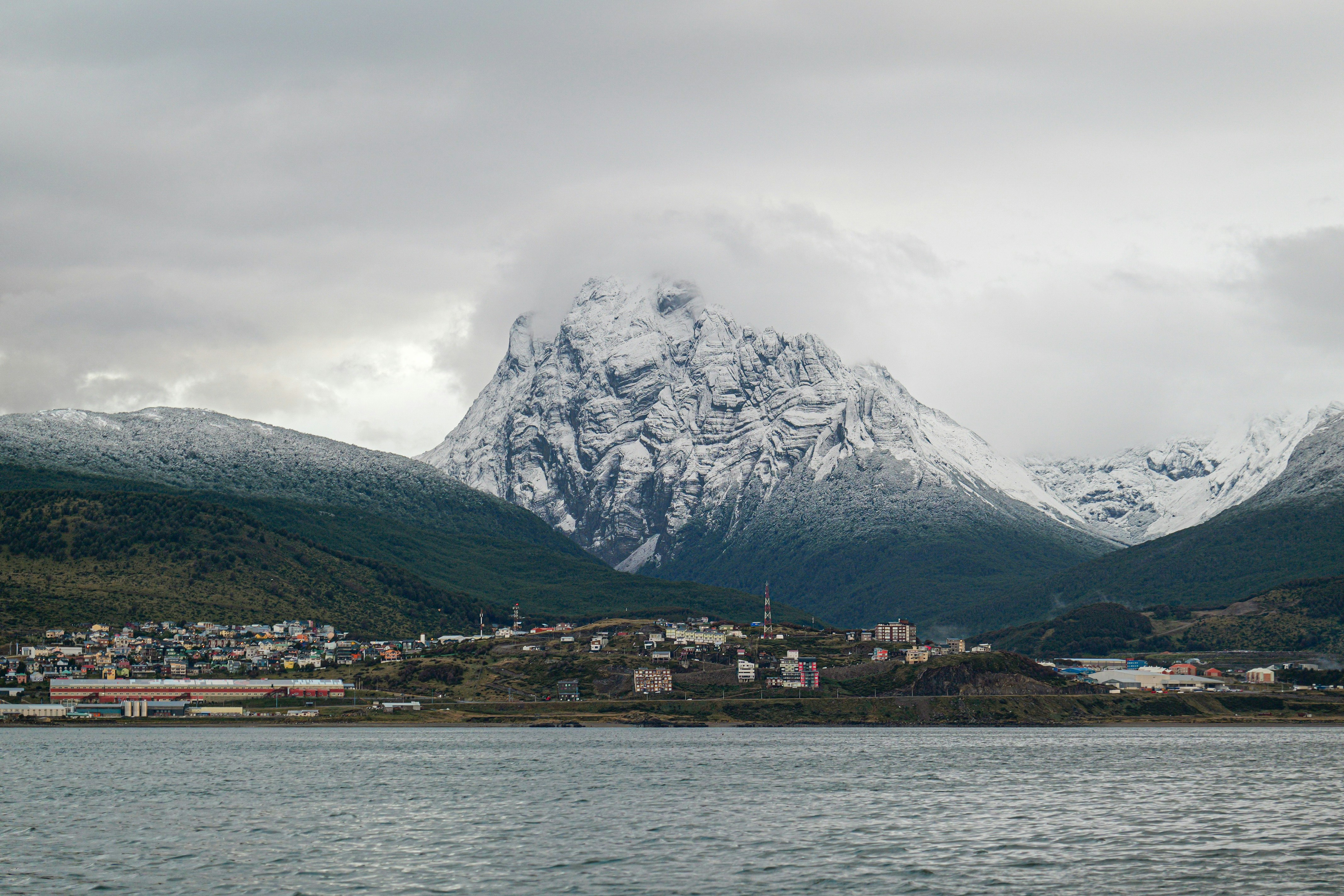 A large body of water with mountains in the background
