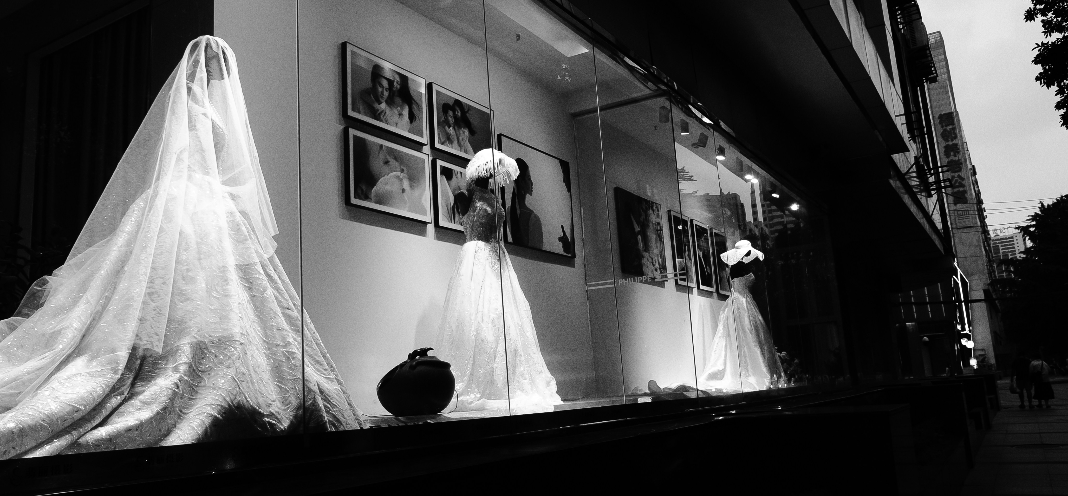 VintageFrench fashion archive photograph, vintage couture gown on display, museum lighting, black and white aesthetic