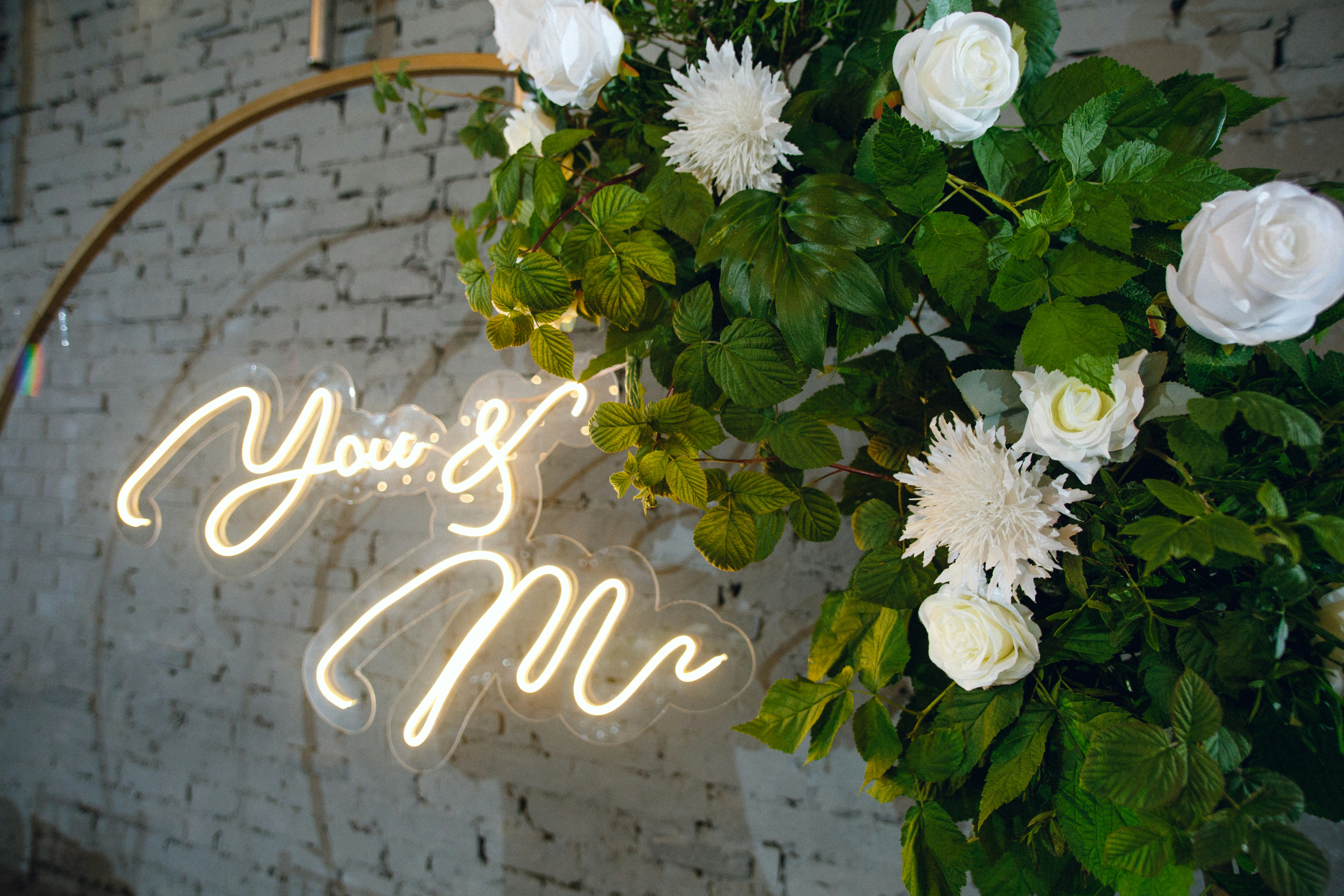 A neon sign that says, you're mr and mrs