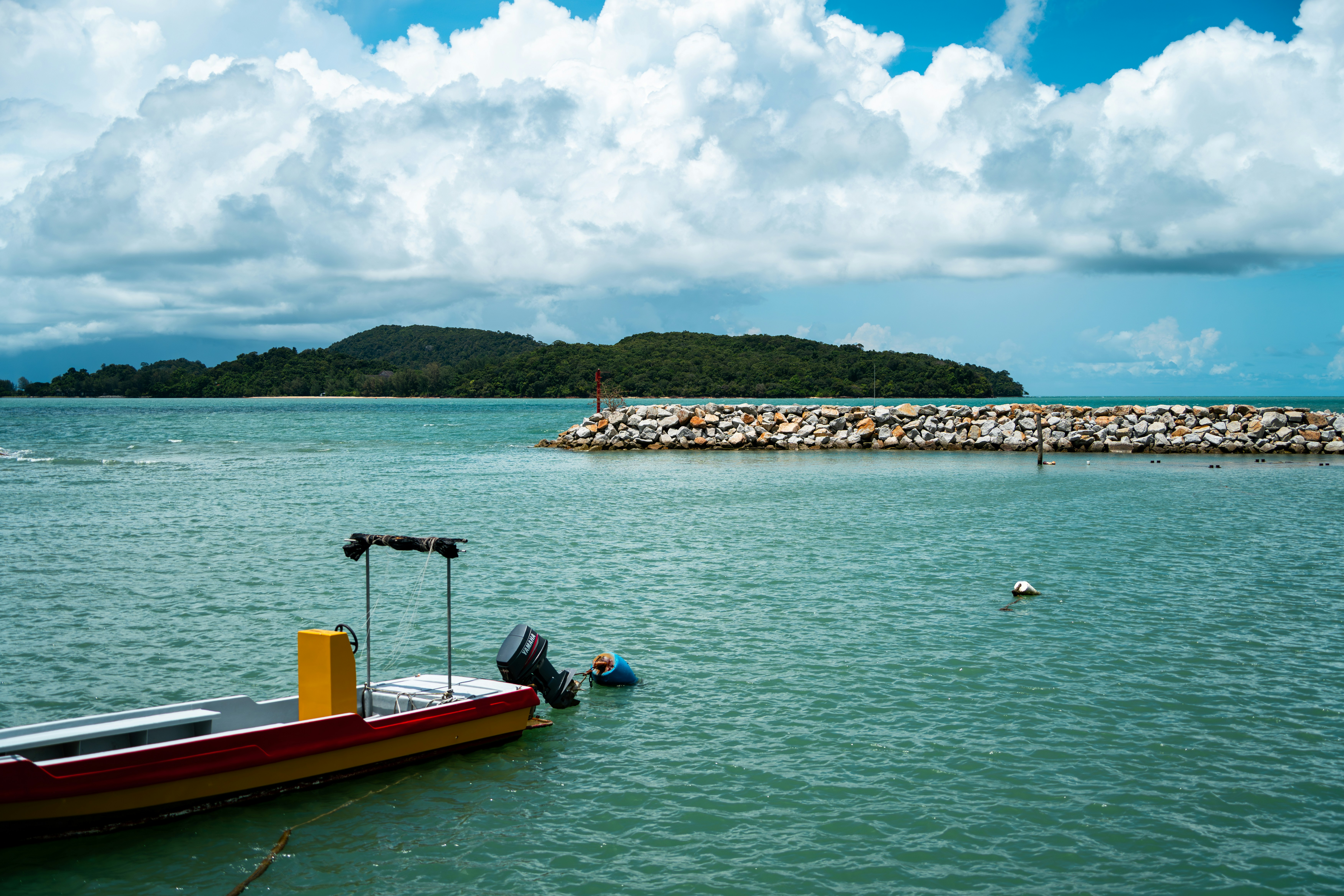 A small boat floating on top of a large body of water - Langkawi