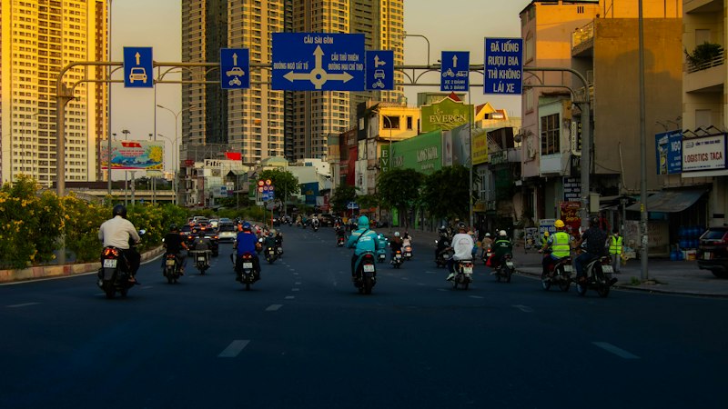 Motorbikes pouring down a busy street in Ho Chi Minh City
