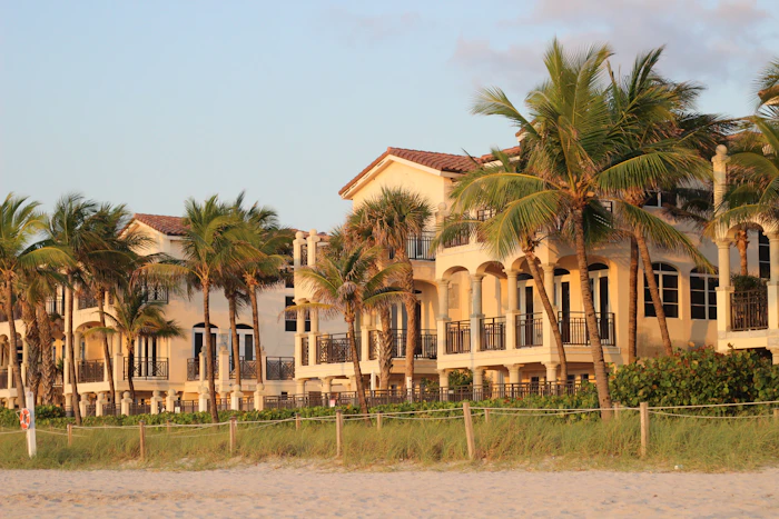 Row of beach houses with palm trees
