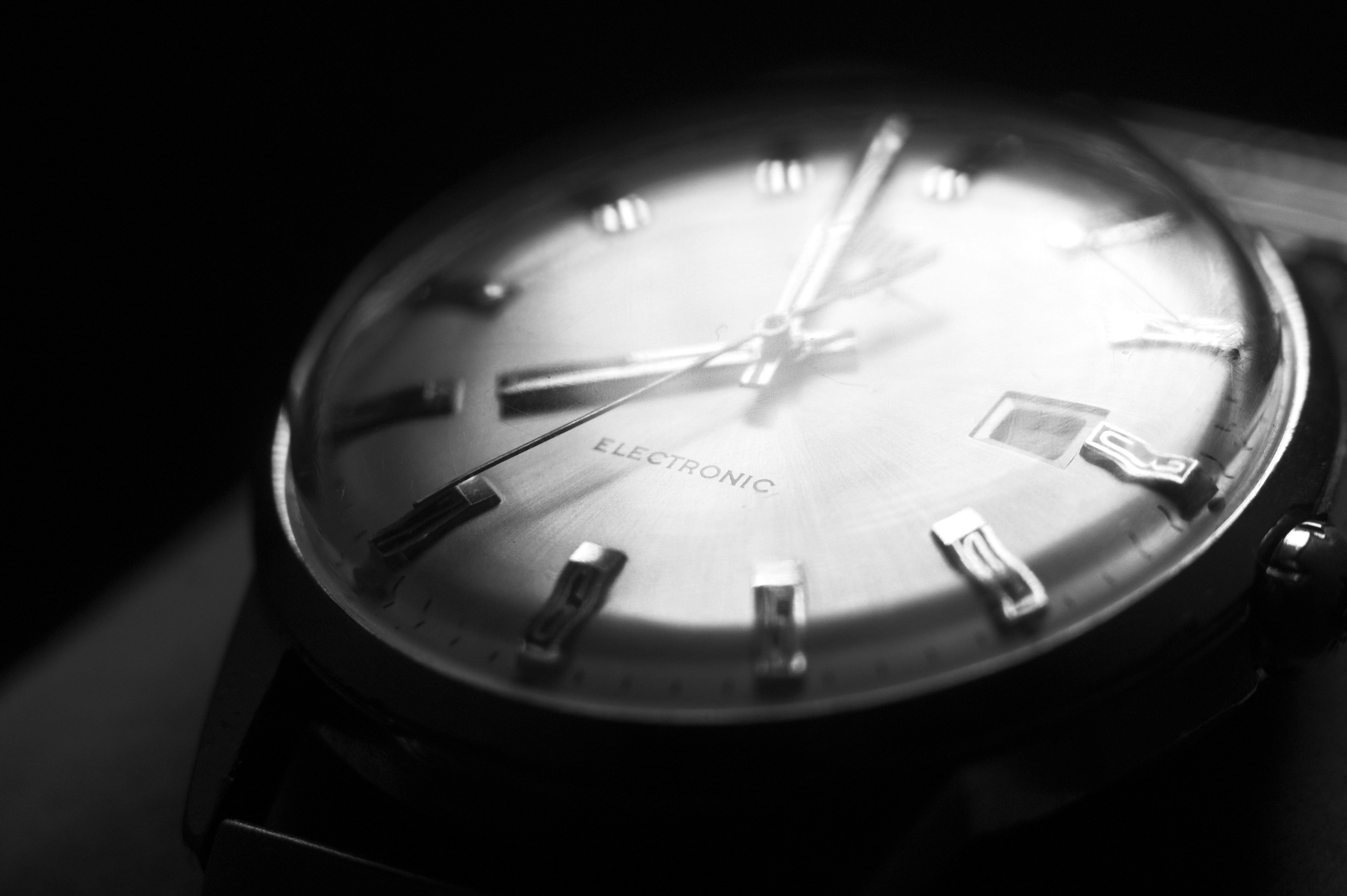 A black and white photo of a watch