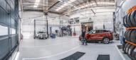 A car is parked inside of a garage