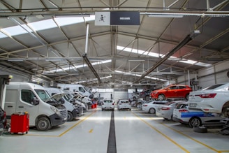 A warehouse filled with lots of cars and trucks