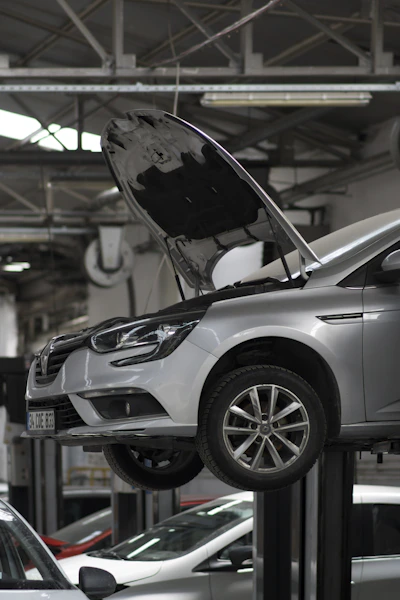 A car being worked on in a car repair shop