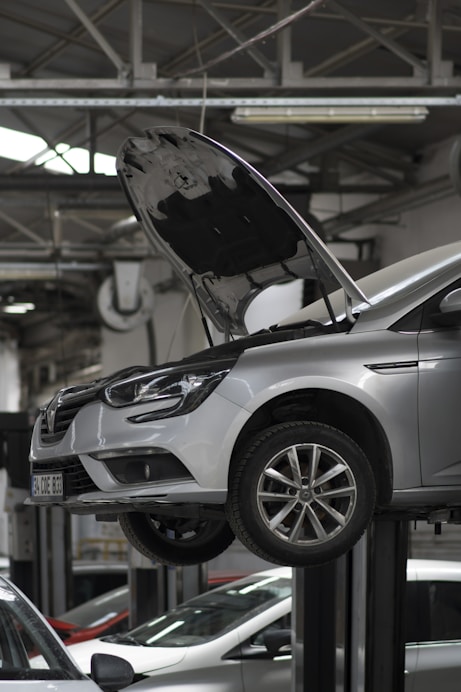 A car being worked on in a car repair shop