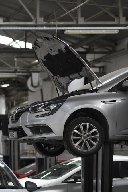 A car being worked on in a car repair shop