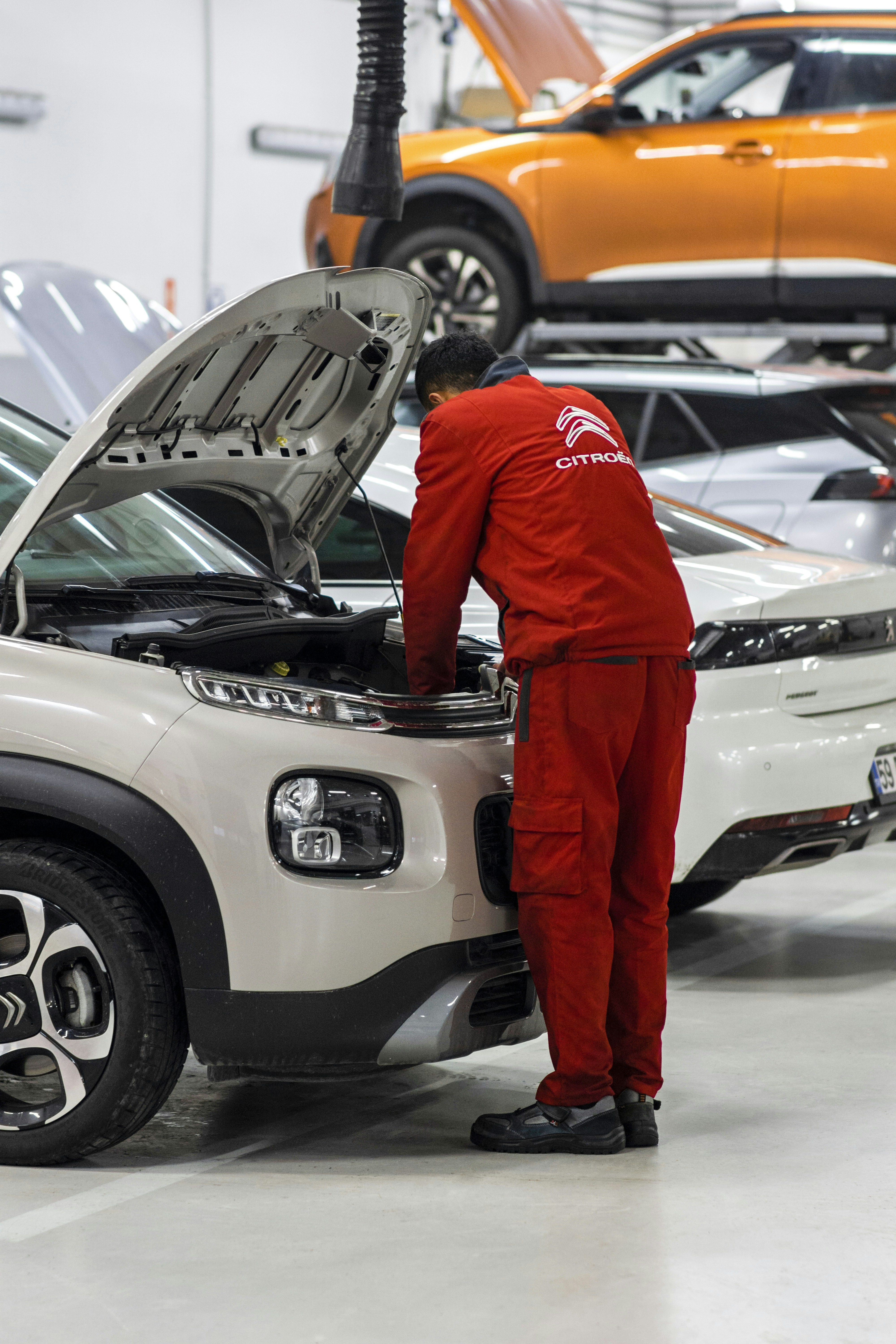 A man working on a car in a garage