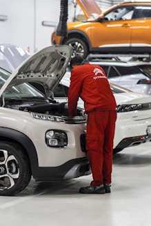 A man working on a car in a garage
