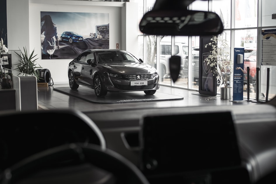 A car is parked inside of a showroom