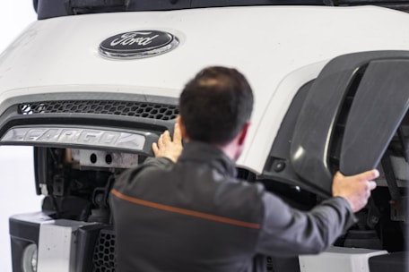 A man working on a car in a garage