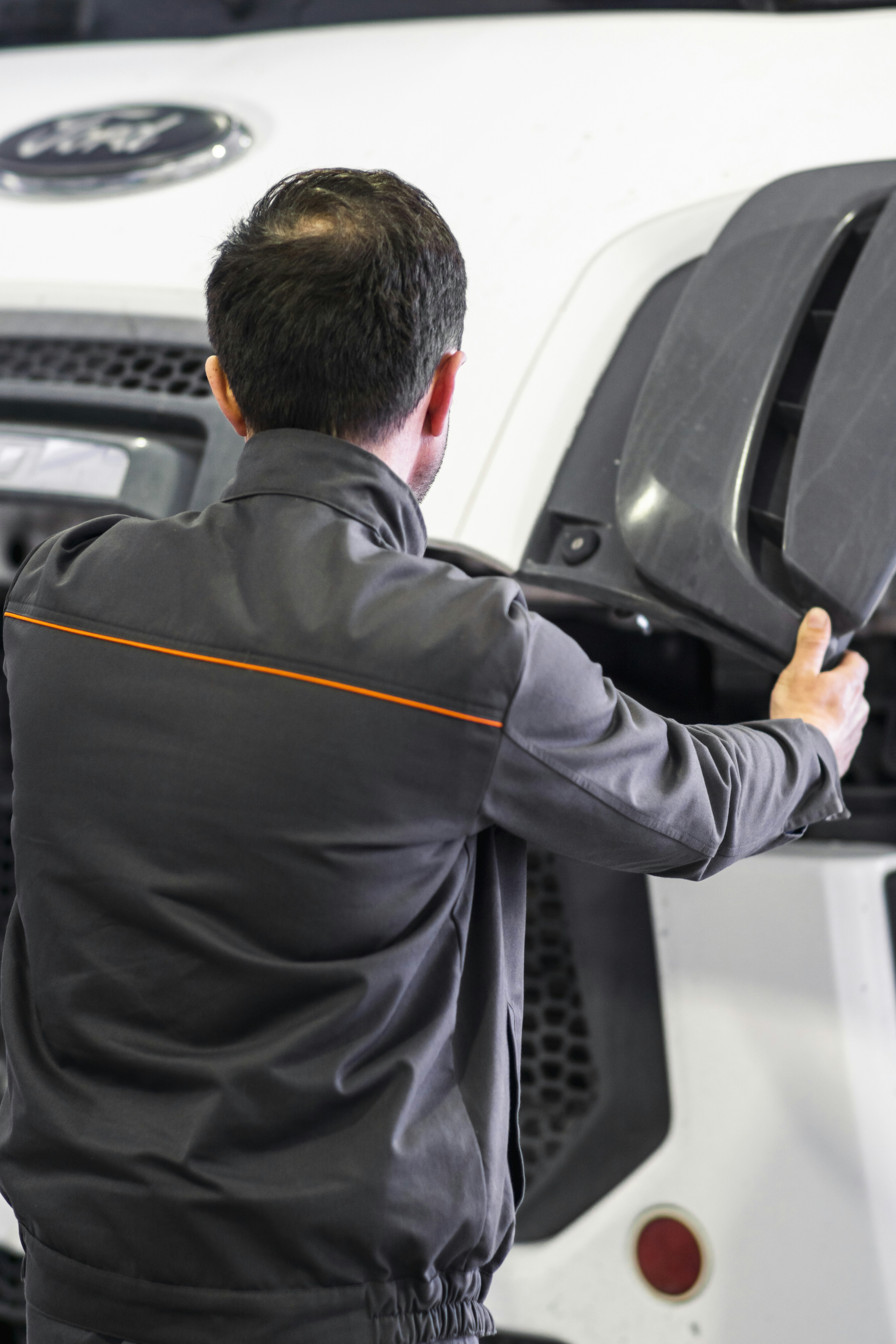 A man working on a car in a garage
