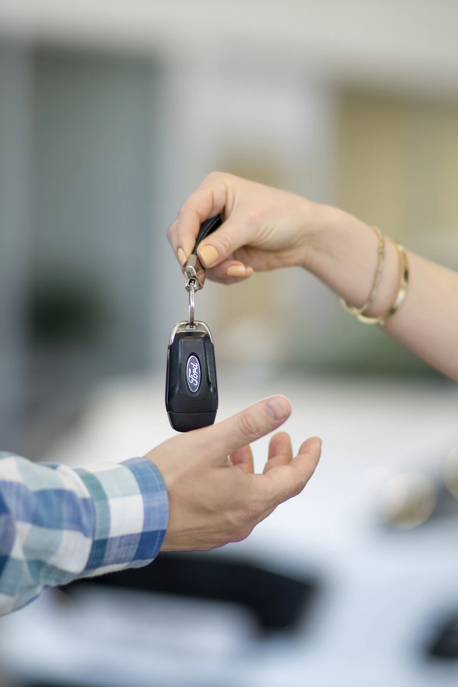 Customer receiving car keys at rental counter