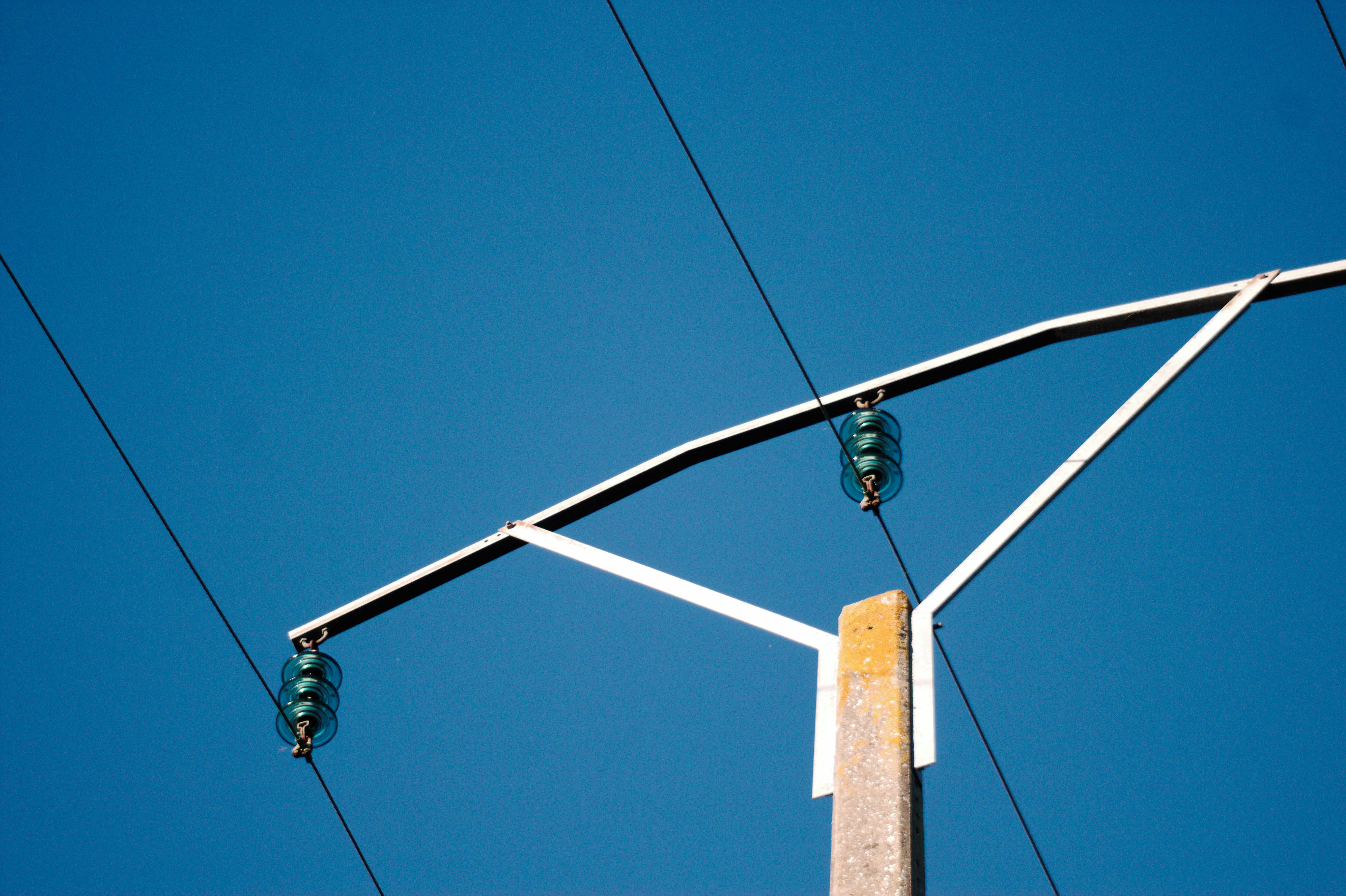 A street light with a blue sky in the background