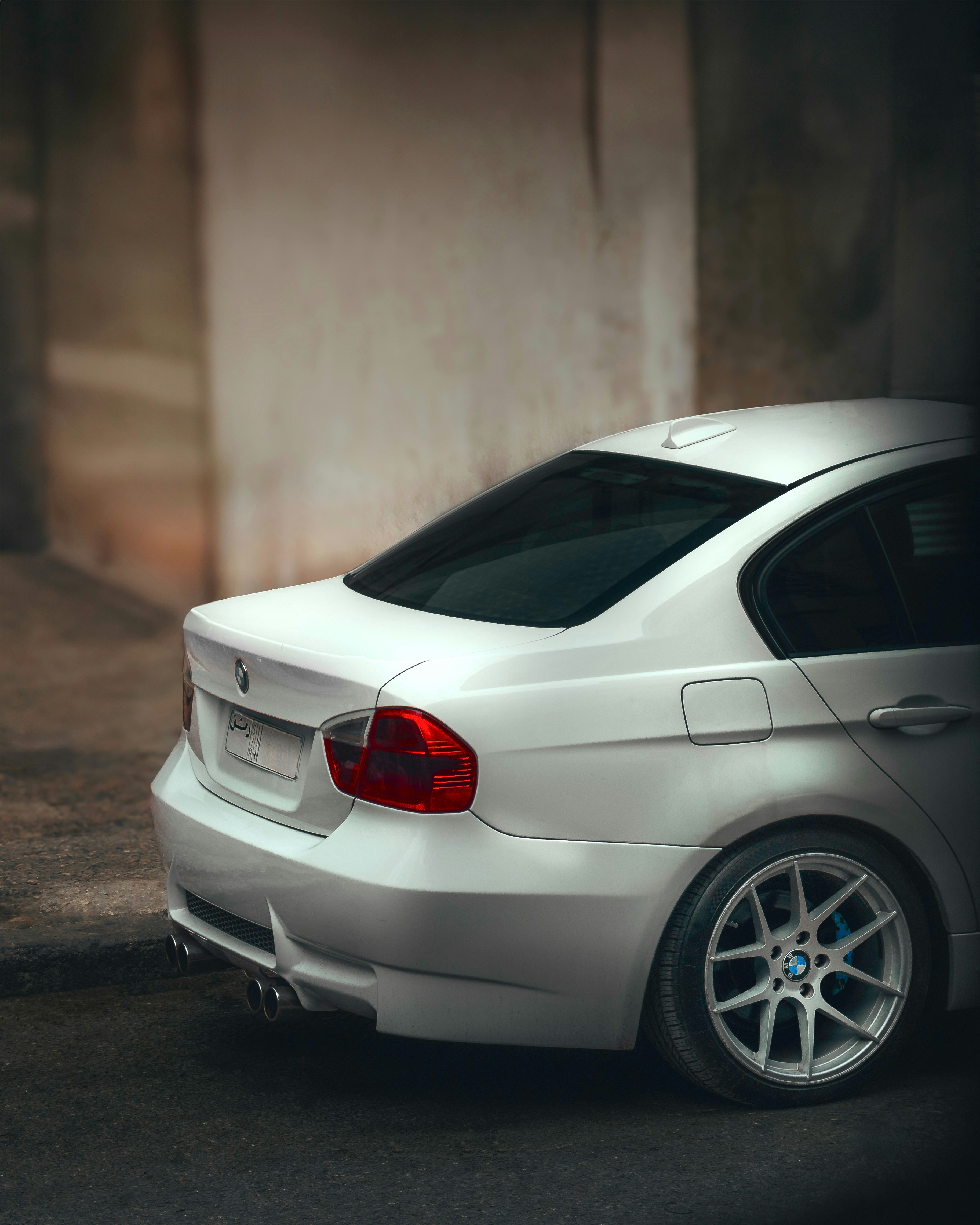 A white car parked on the side of the road