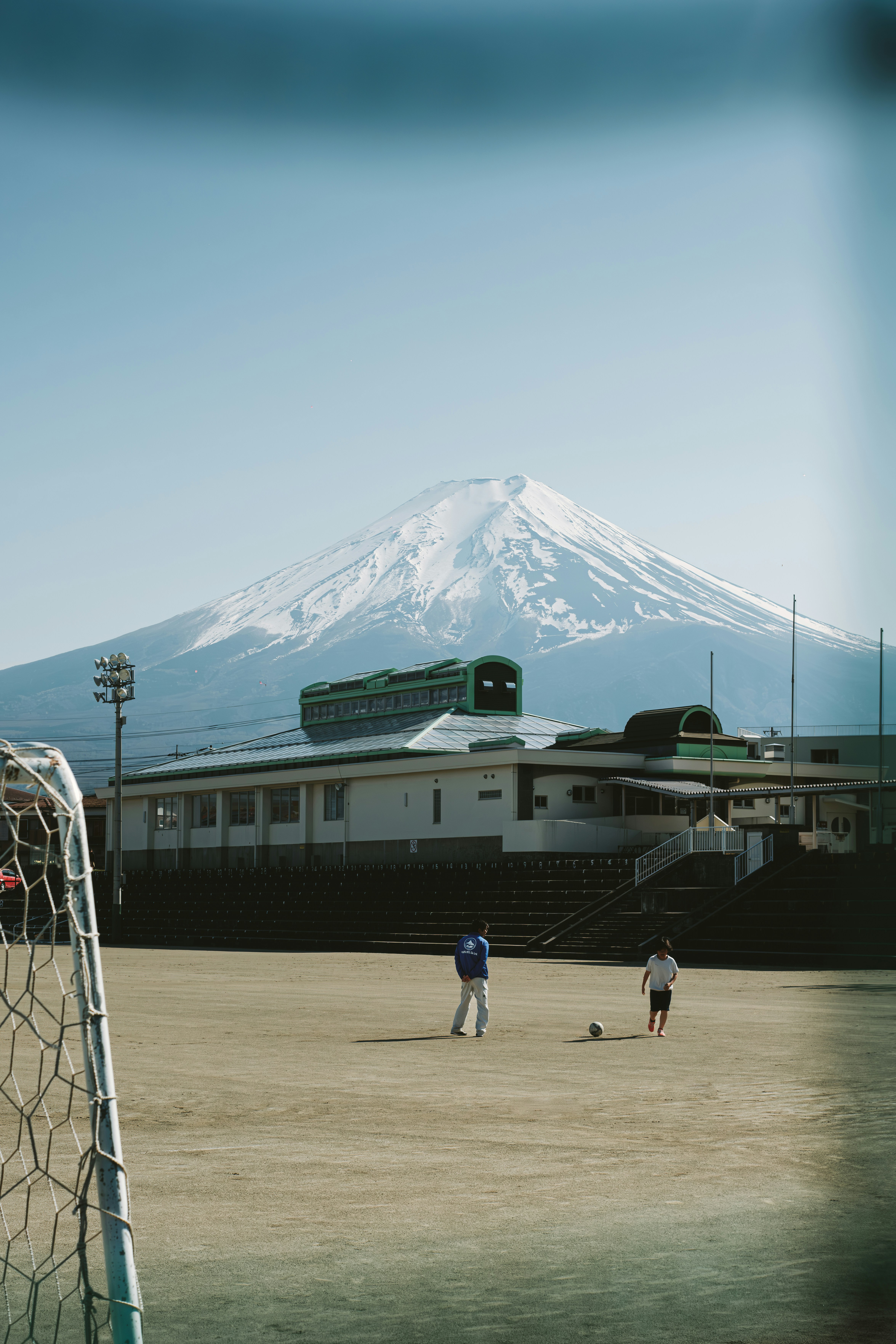 A group of people playing a game of soccer