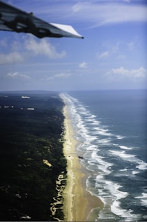 A view of a beach from an airplane