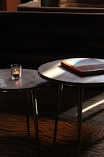 A couple of tables sitting on top of a wooden floor