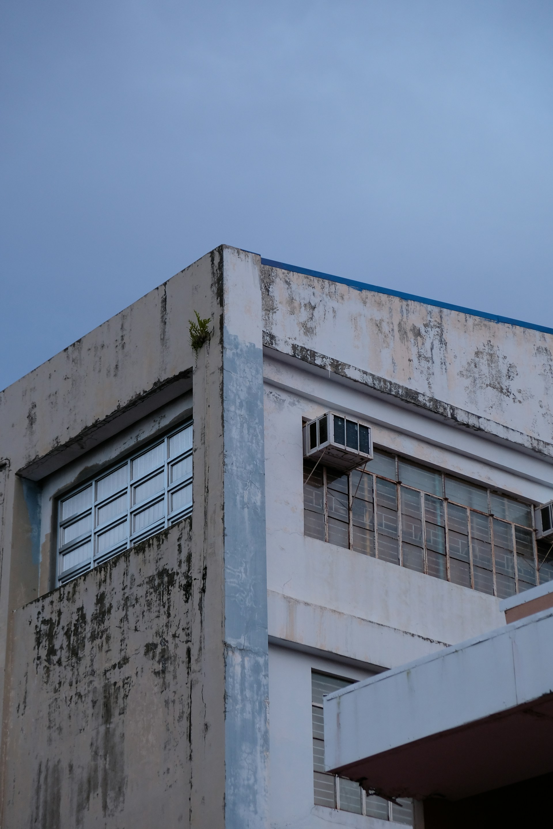 An old building with a clock on the top of it