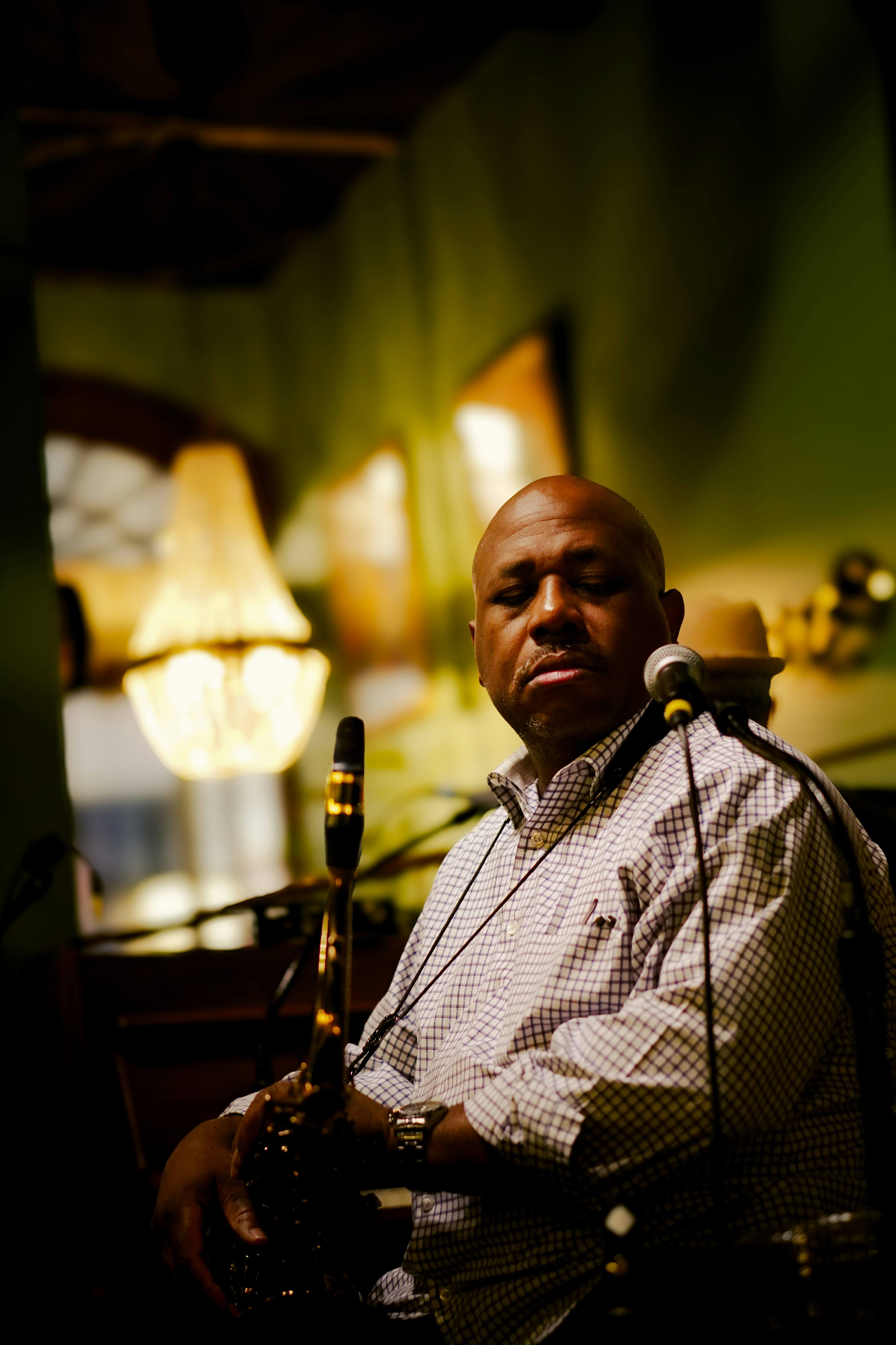 A man sitting in front of a microphone