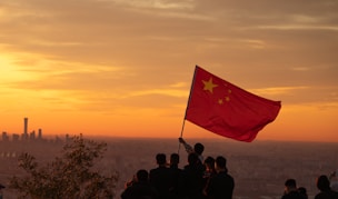 A group of people standing on top of a hill