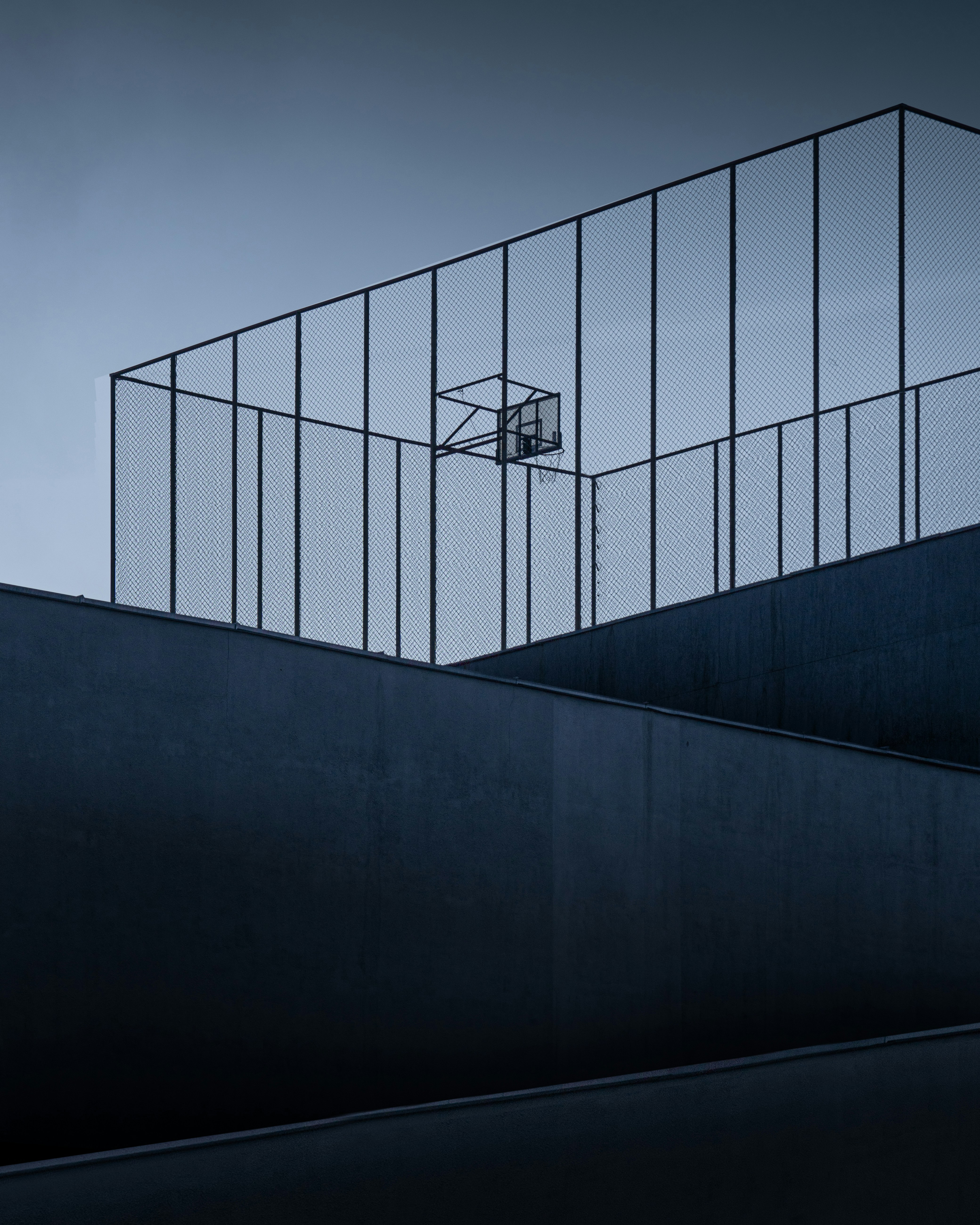 A man riding a skateboard down the side of a ramp