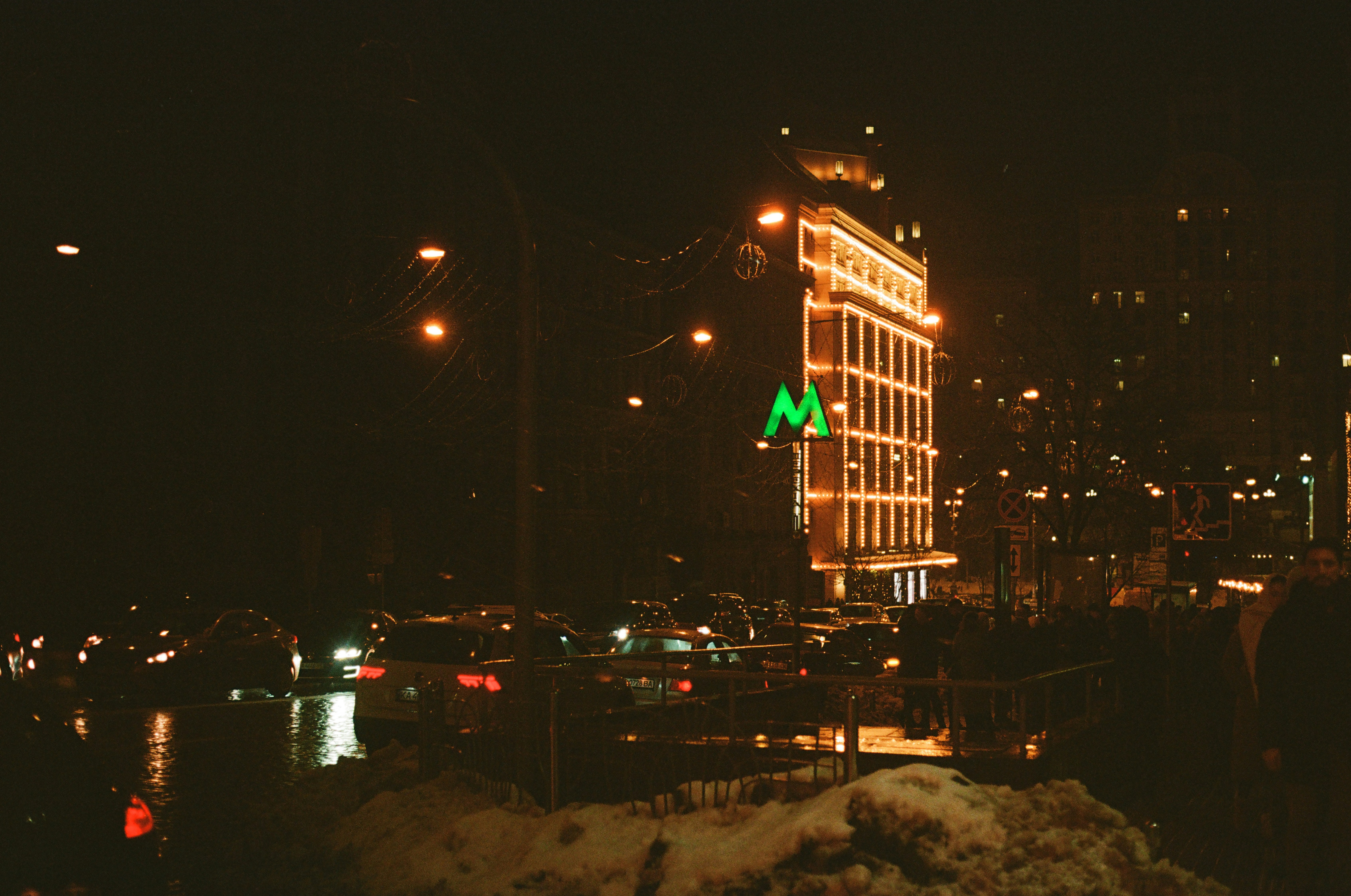 A large building with a green arrow on top of it