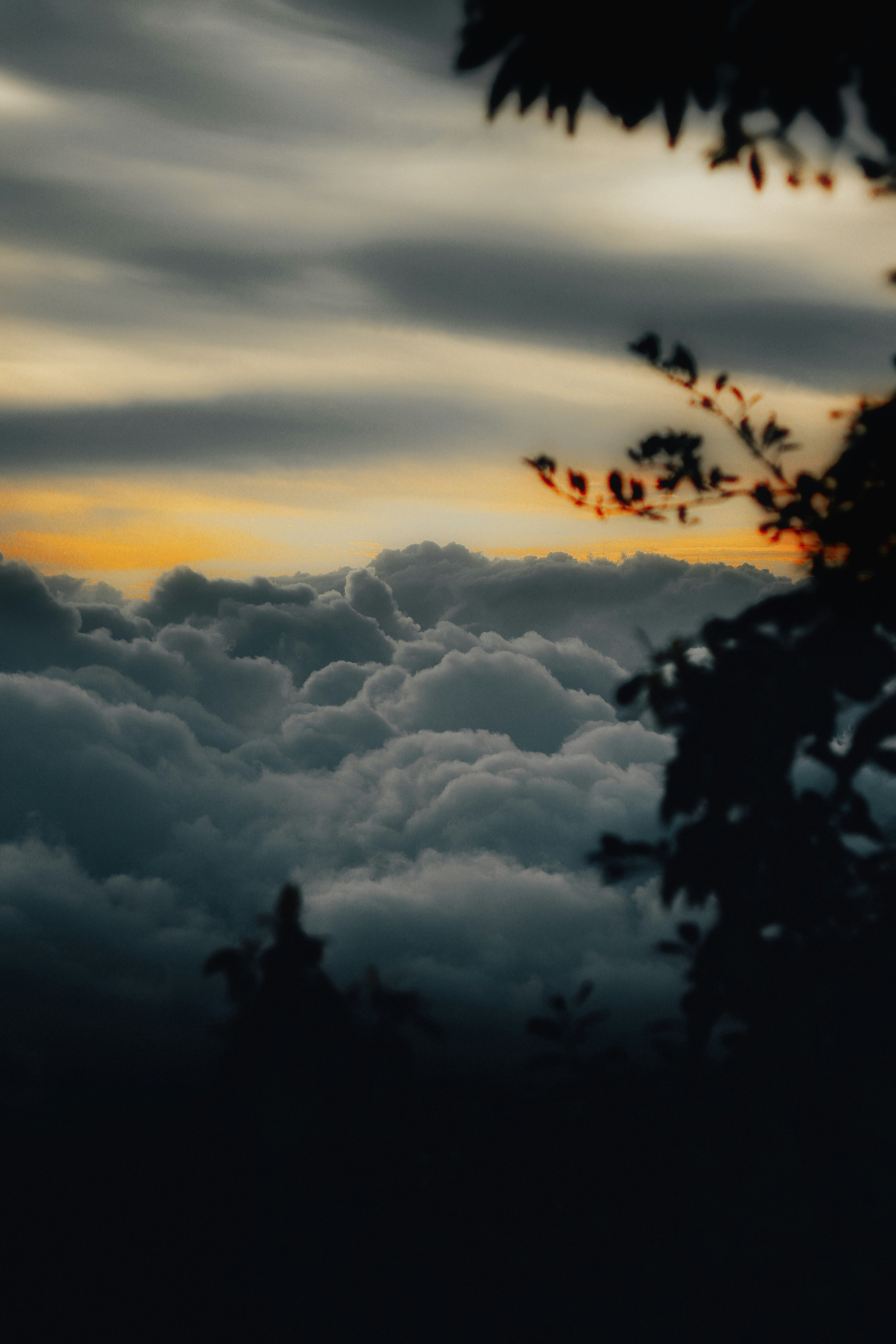 A view of the sky and clouds from the top of a hill