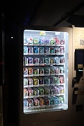 A vending machine with a lot of candy inside of it