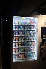 A vending machine with a lot of candy inside of it