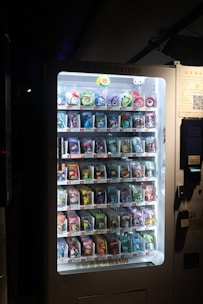 A vending machine with a lot of candy inside of it