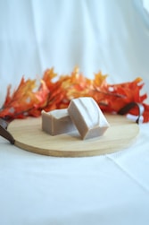 A couple of cubes of food on a cutting board