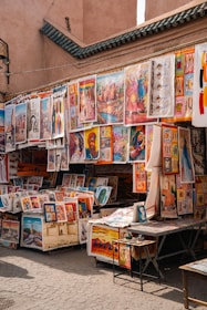 A street scene with a store selling newspapers