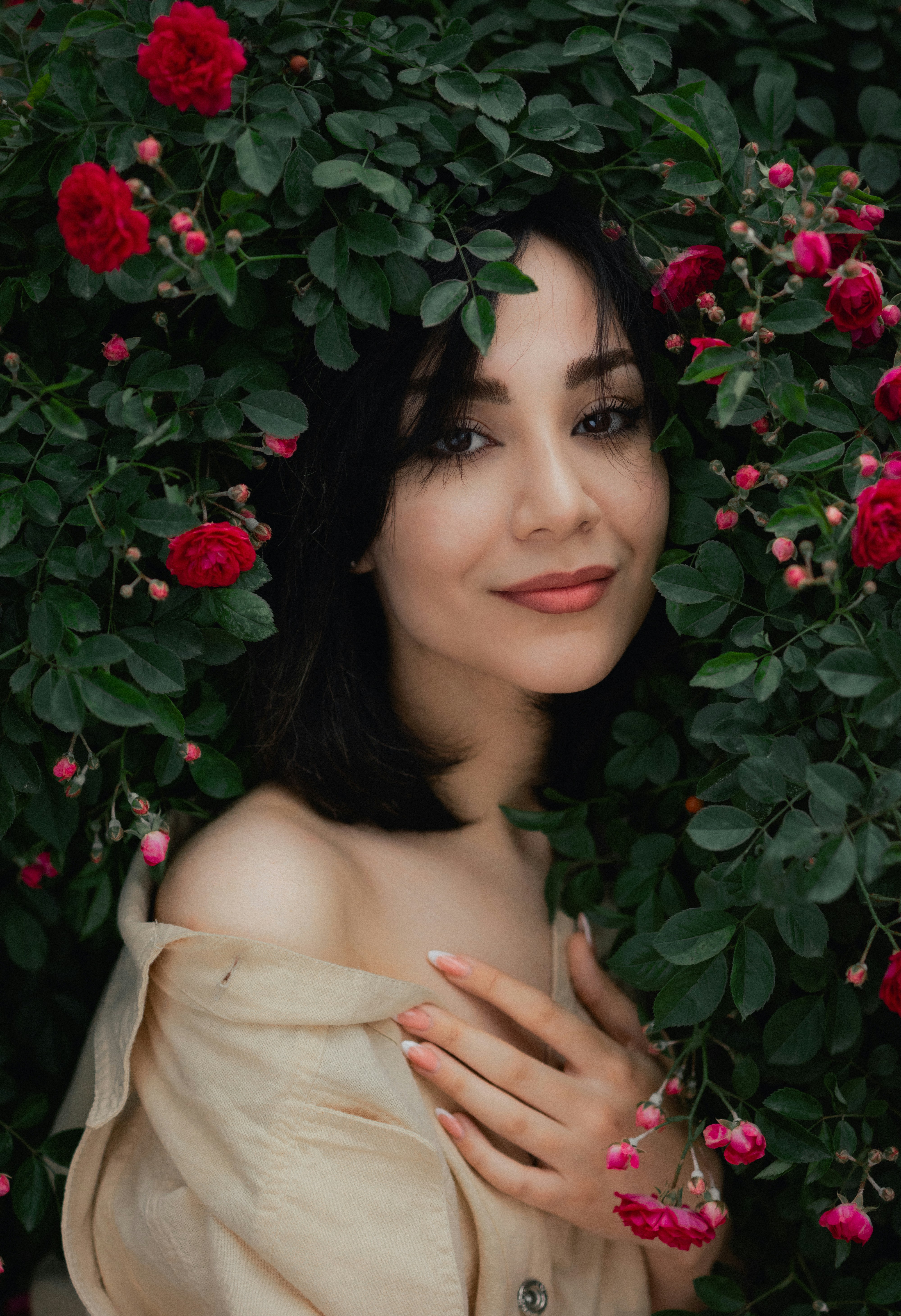 A woman in a white dress surrounded by flowers