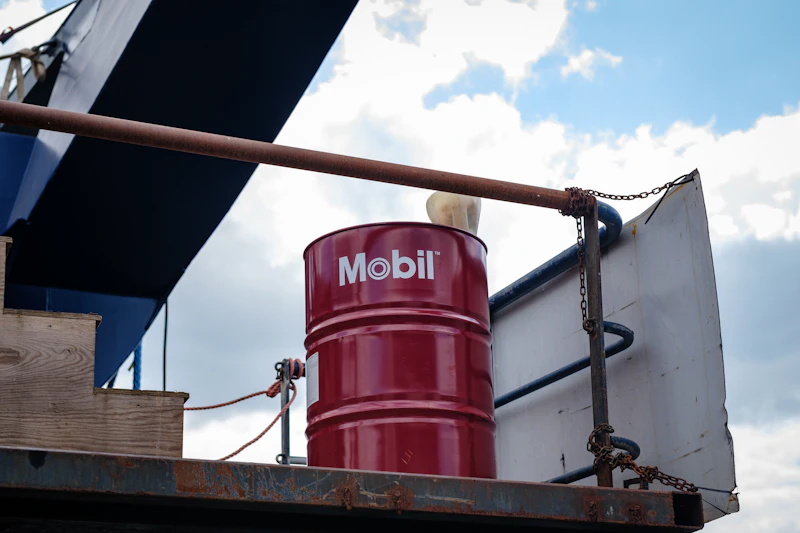 Red fuel drum loaded on truck