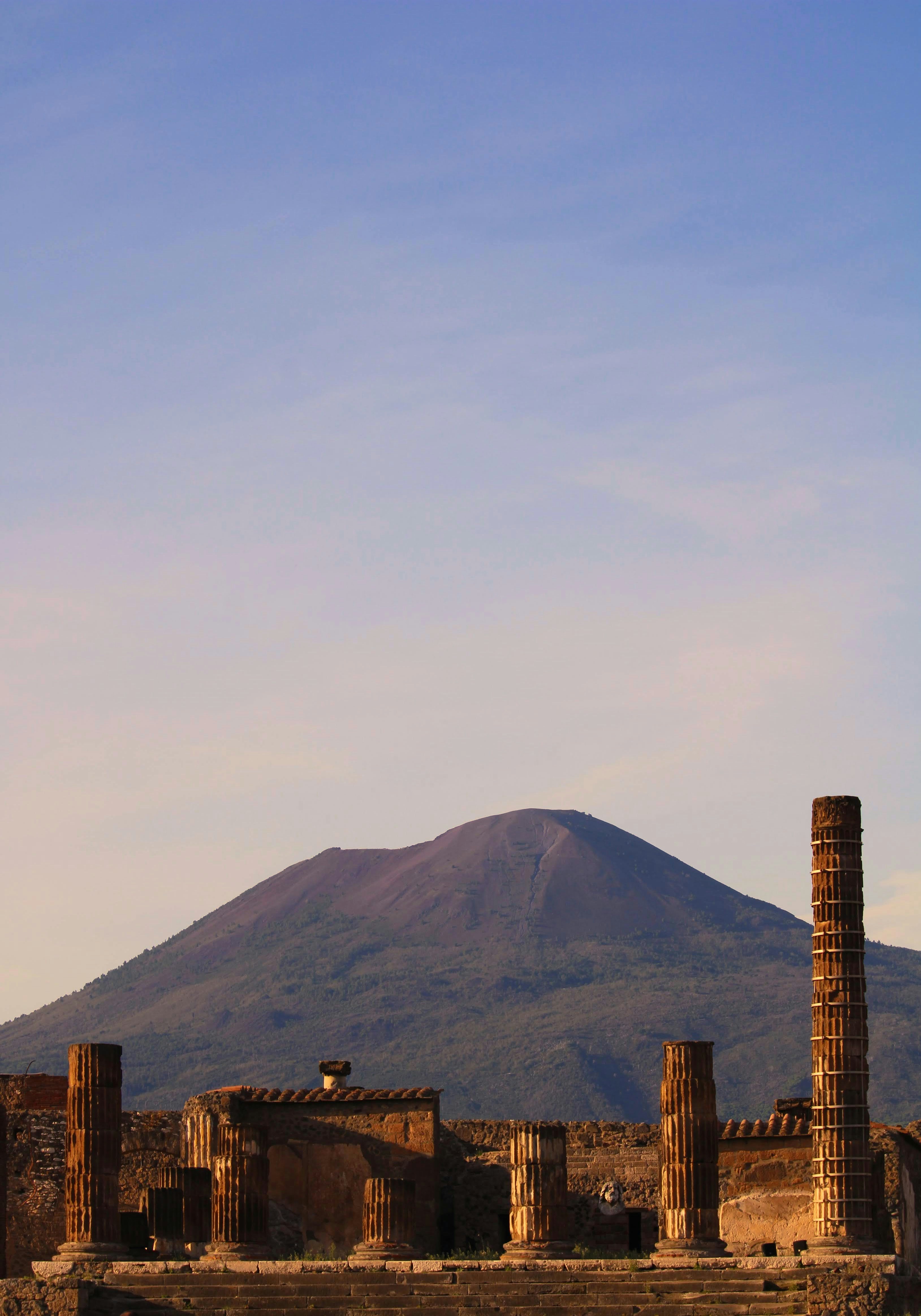 A mountain in the background with a building in the foreground