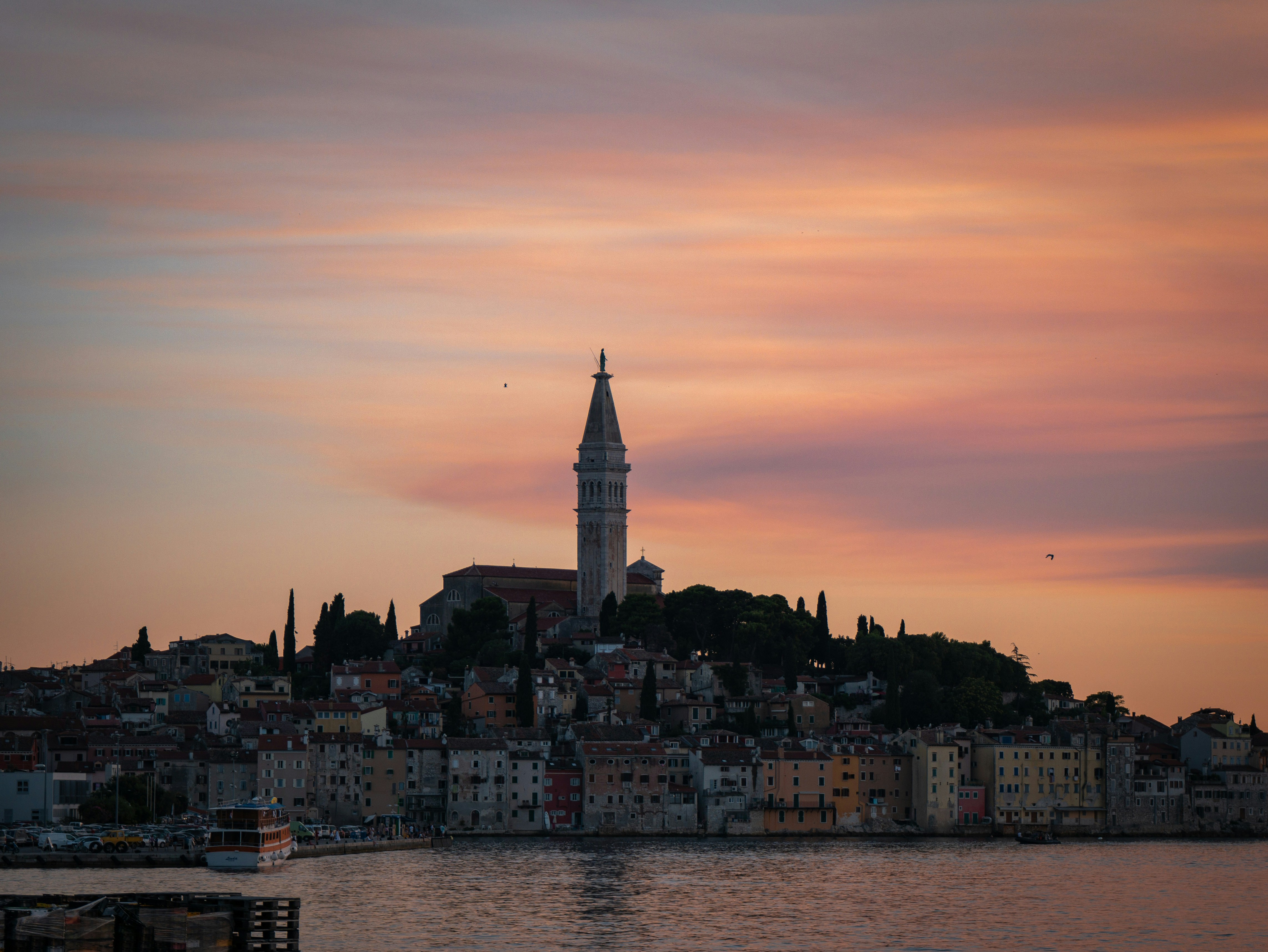 A large body of water with a city in the background