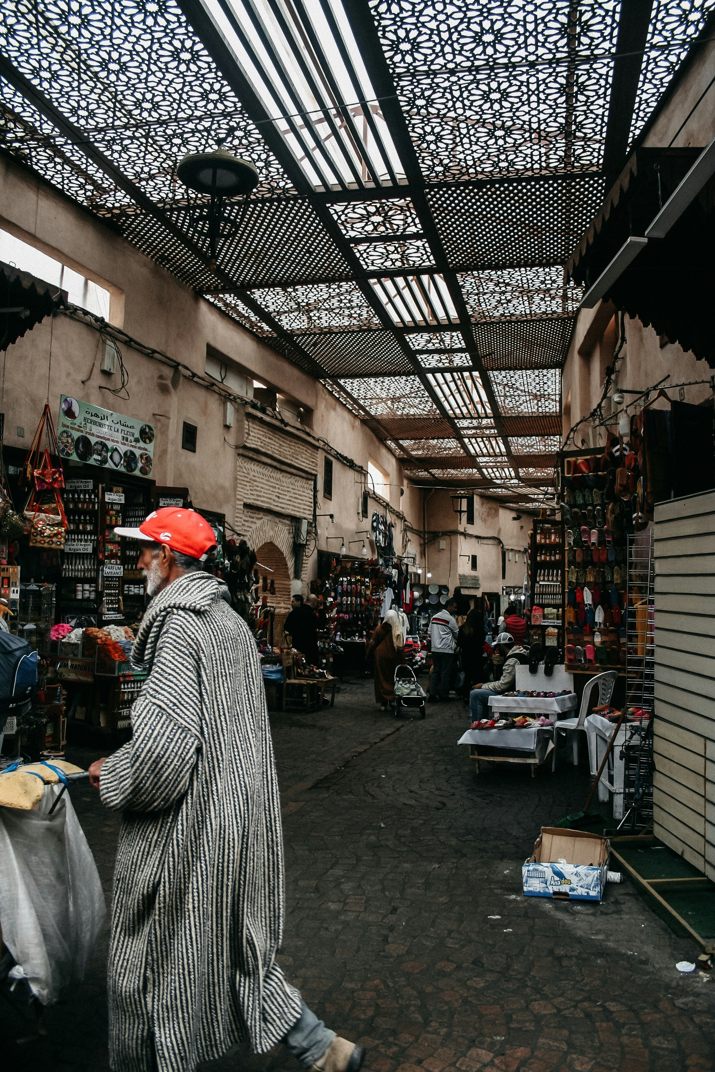 A man is walking through a crowded market