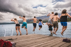 Kids jumping off a dock