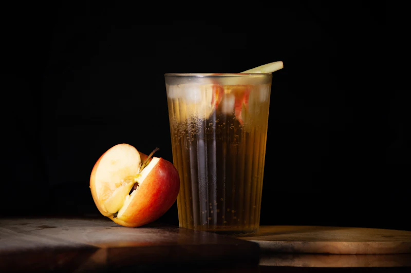Apple next to a glass