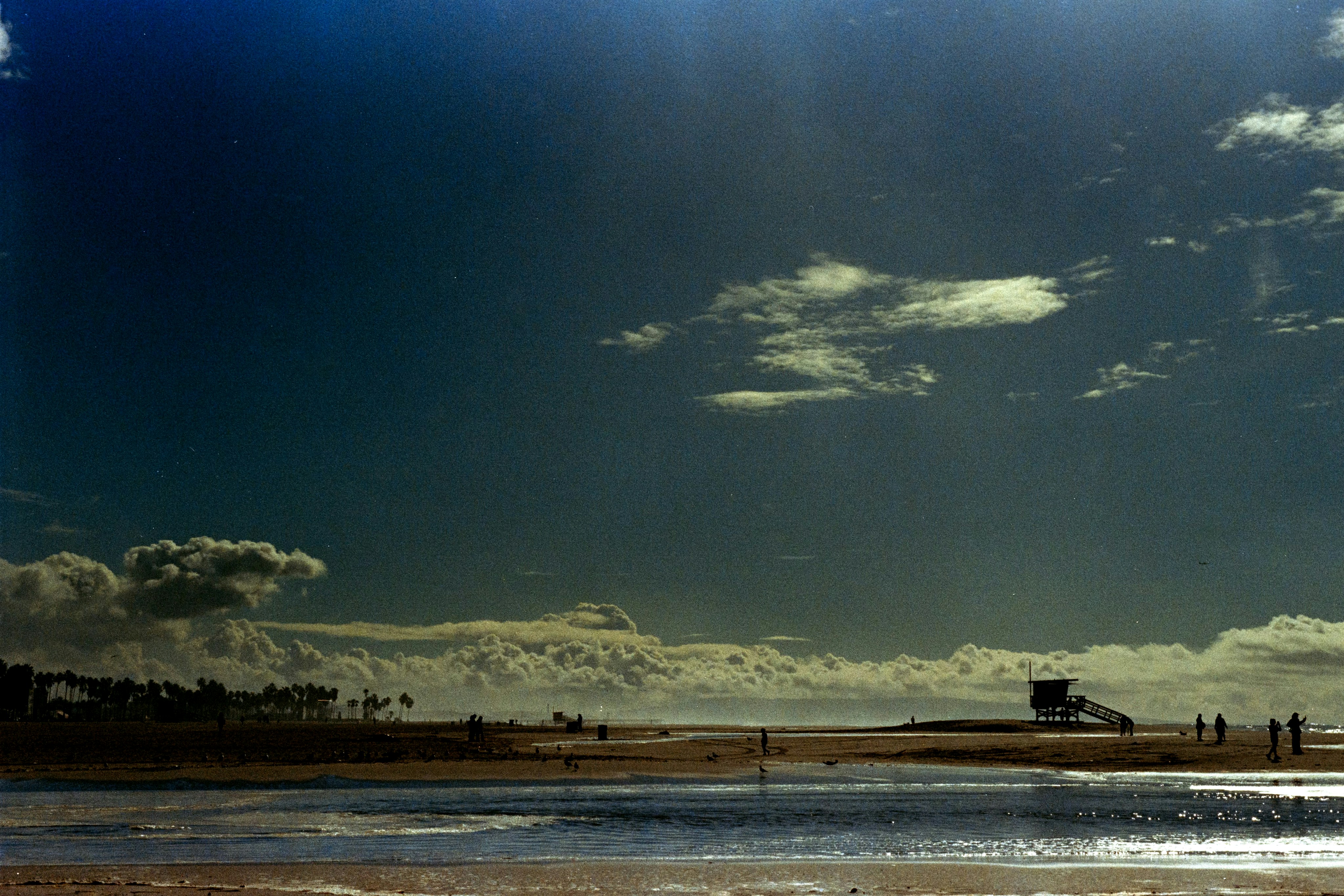 A large body of water sitting under a cloudy sky