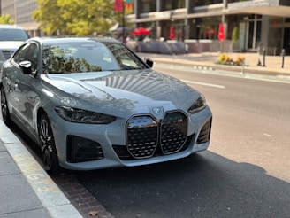 A silver car parked on the side of the road
