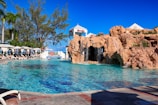 A large pool with a waterfall next to it