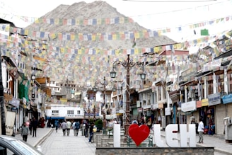 A city street filled with lots of tall buildings
