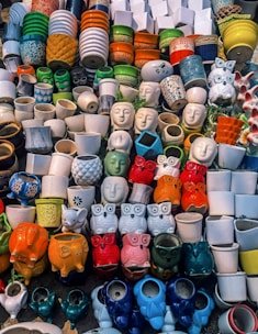A pile of different kinds of shoes on display